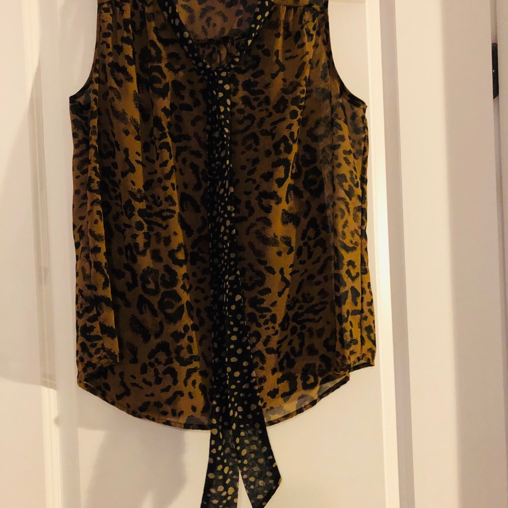 Sleeveless leopard print blouse.